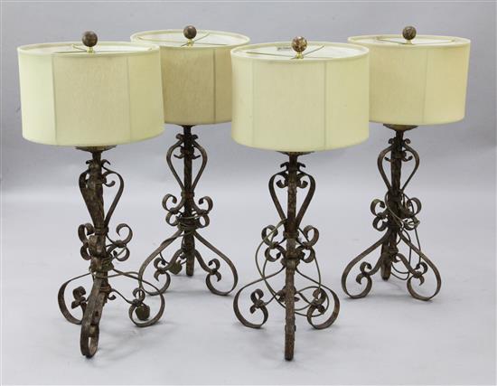 A set of four wrought iron table lamps, H.38in.